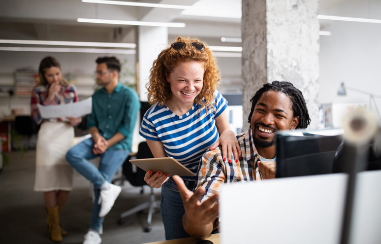 Happy co-workers in a positive work environment